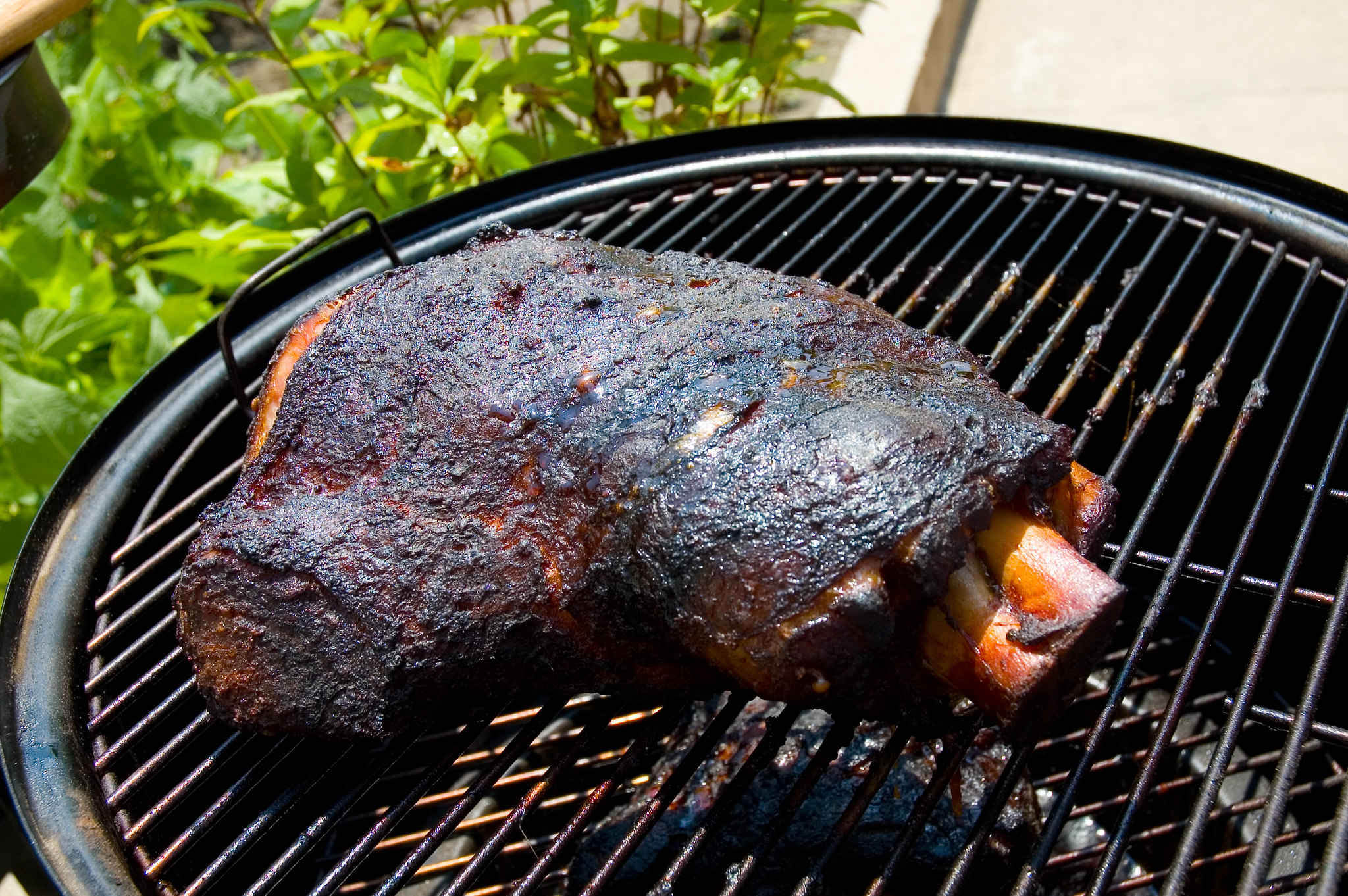 Should you wrap the pork shoulder in foil during the smoke?
